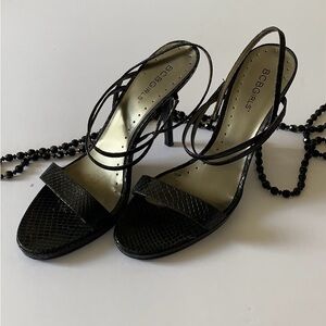 BCBG black snakeskin strappy heel.